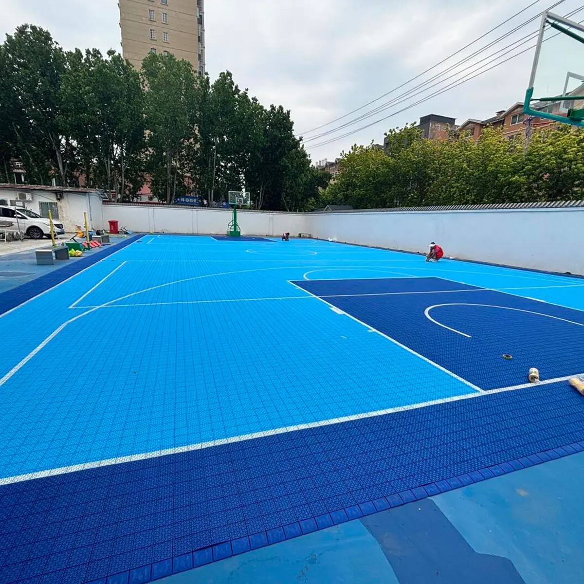 Outdoor modular sports court with blue and green activity zones