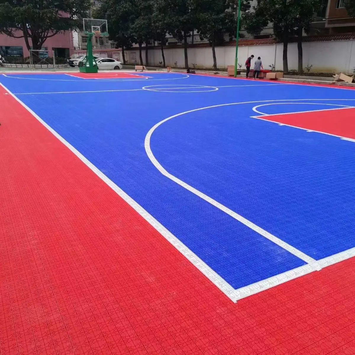 Outdoor basketball court finished with modular floor tiles